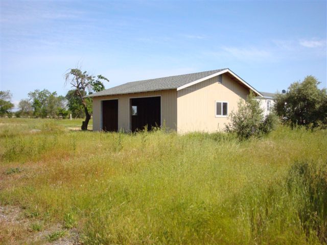 5731 State Highway 99w Corning, CA 96021 - Photo 2 of 6 a view of a house with a yard