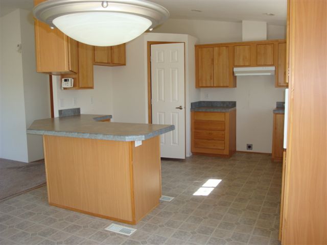 5731 State Highway 99w Corning, CA 96021 - Photo 4 of 6 a view of a kitchen with a sink cabinets and a dishwasher