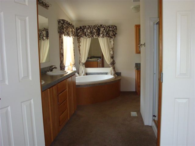 5731 State Highway 99w Corning, CA 96021 - Photo 6 of 6 a utility room with a sink dryer and washer