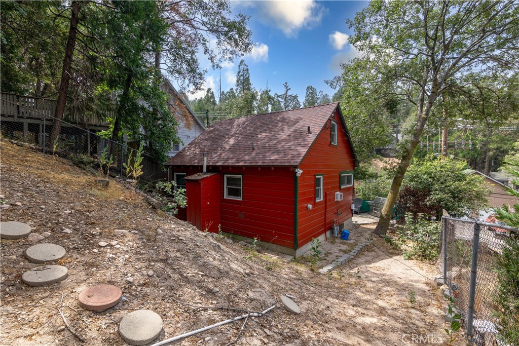 23526 Knapps Cutoff Crestline, CA 92325 - Photo 24 of 30 a view of a backyard with large trees and plants