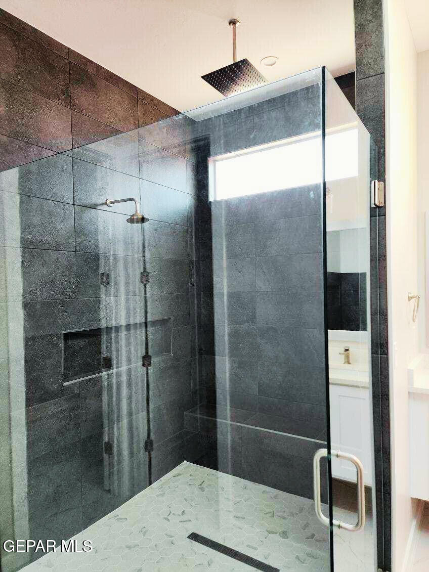 3145 Tunnel Point Way El Paso, TX 79938 - Photo 7 of 20 a bathroom with a shower and a sink
