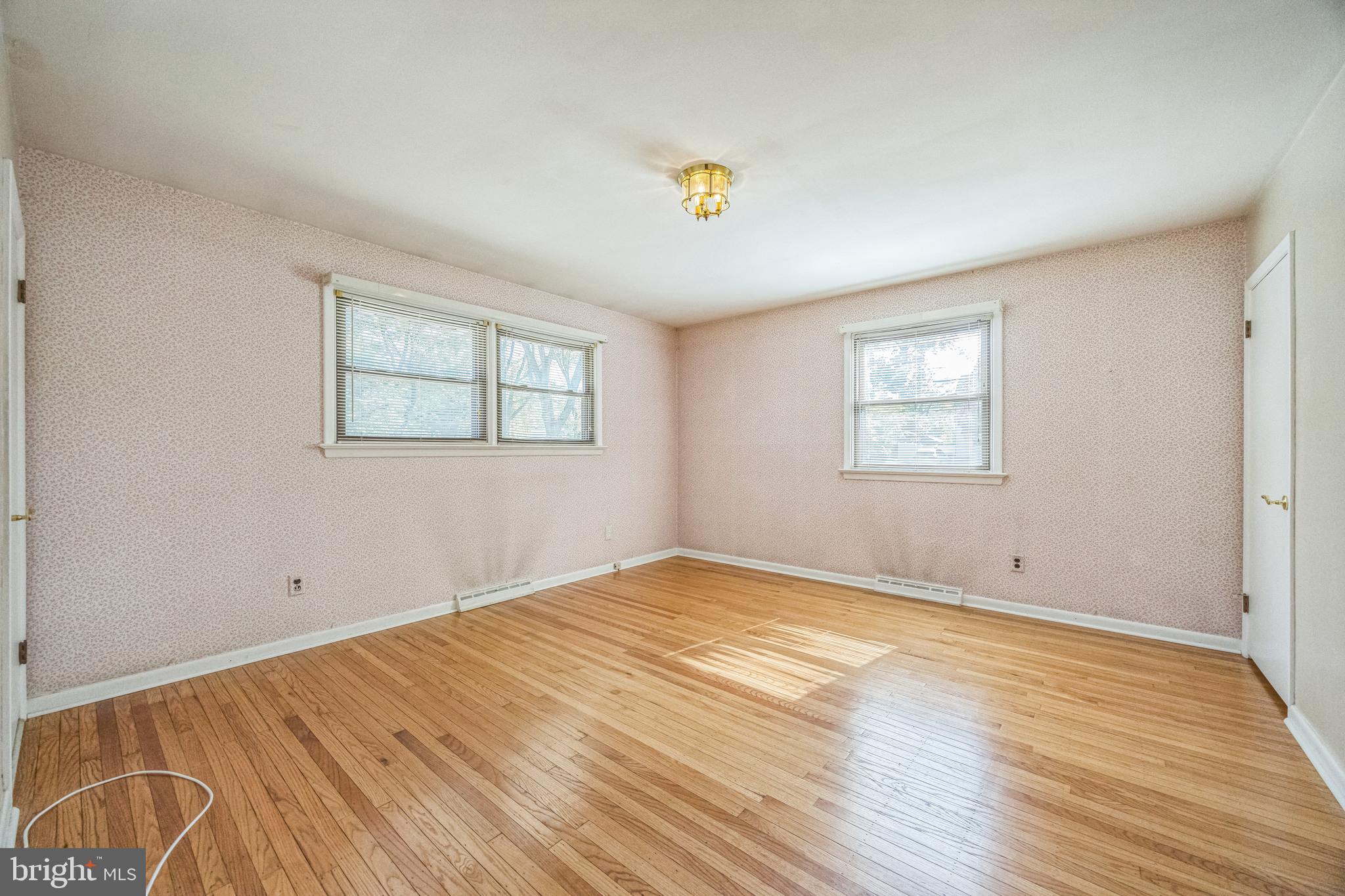 835 Wayside Lane Haddonfield, NJ 08033 - Photo 25 of 36 a view of empty room with wooden floor and fan