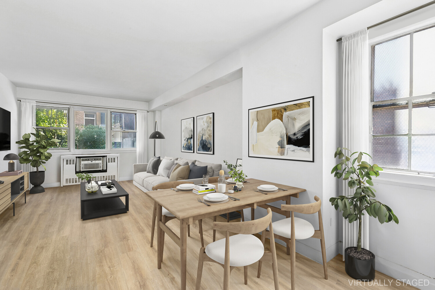 245 East 35th Street, Unit 4H Manhattan, NY 10016 - Photo 1 of 5 a living room with furniture potted plant and a large window