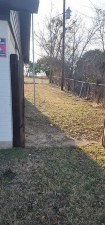 a view of a yard with an outdoor space