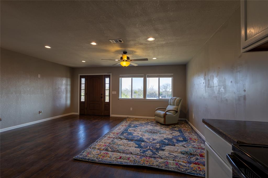 5780 Randle Road Granbury, TX 76049 - Photo 3 of 16 a living room with hard wood floors and a wooden floor