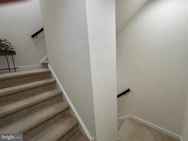 a kitchen with a sink stainless steel appliances and cabinets