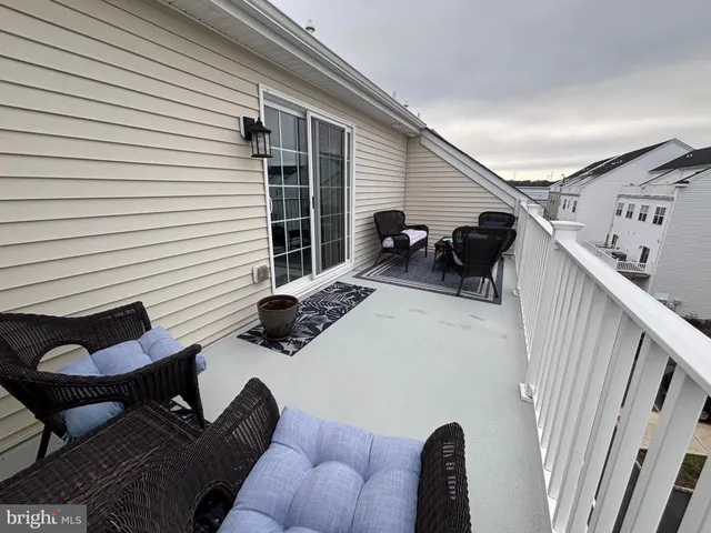 a bathroom with a granite countertop toilet and a sink