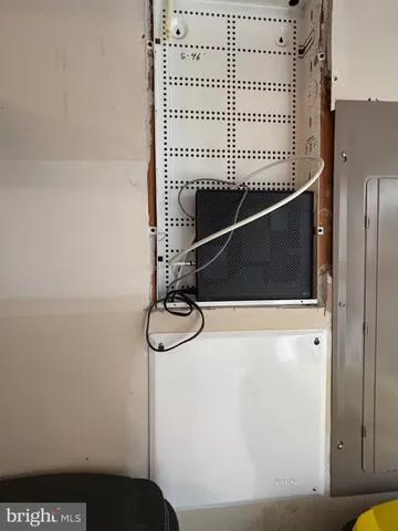 an aerial view of a city with lake view in back