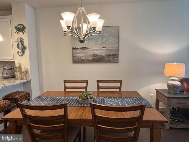 a kitchen with a refrigerator a sink a stove a microwave and cabinets