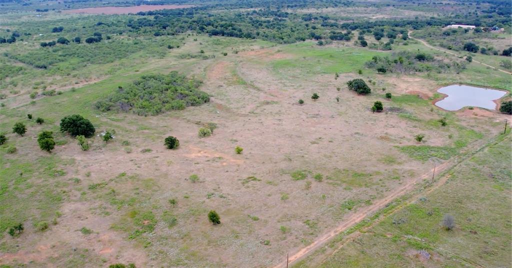 46.86-acres Stewart Ranch Road Loving, TX 76460 - Photo 12 of 17 an aerial view of house with a yard