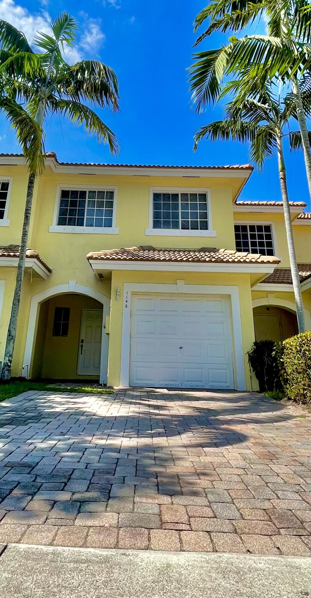 1146 Imperial Lake Road Lake Belvedere Estates, FL 33413 - Photo 1 of 20 a view of front of house with a yard