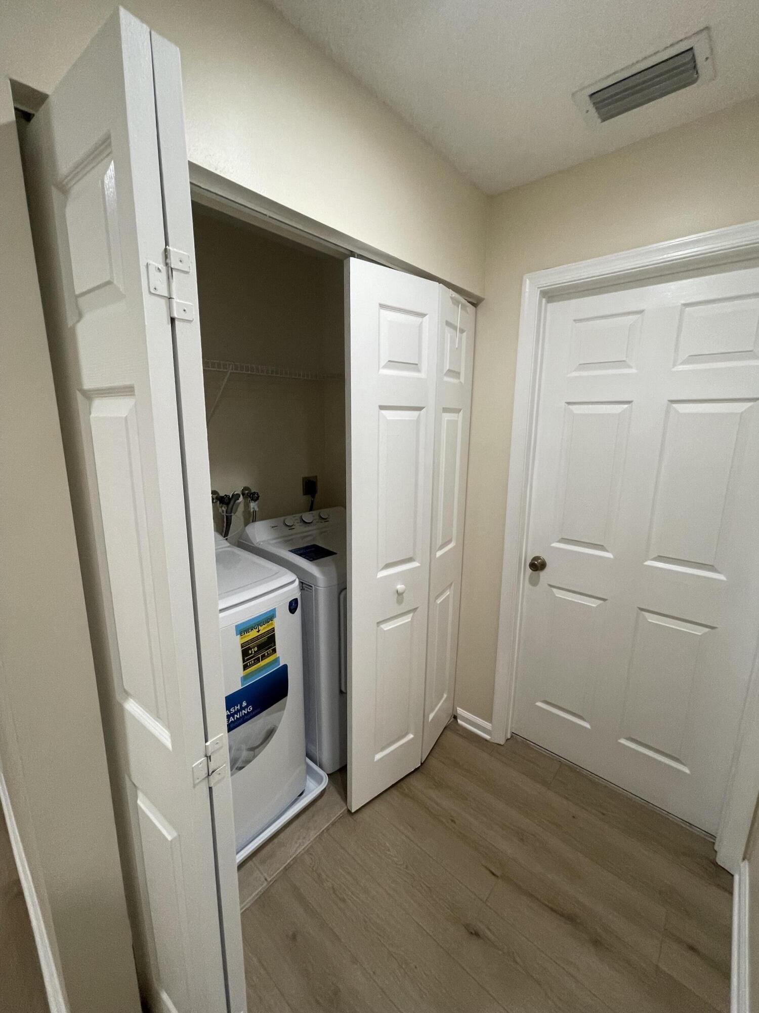 1146 Imperial Lake Road Lake Belvedere Estates, FL 33413 - Photo 12 of 20 a view of an entryway with wooden floor