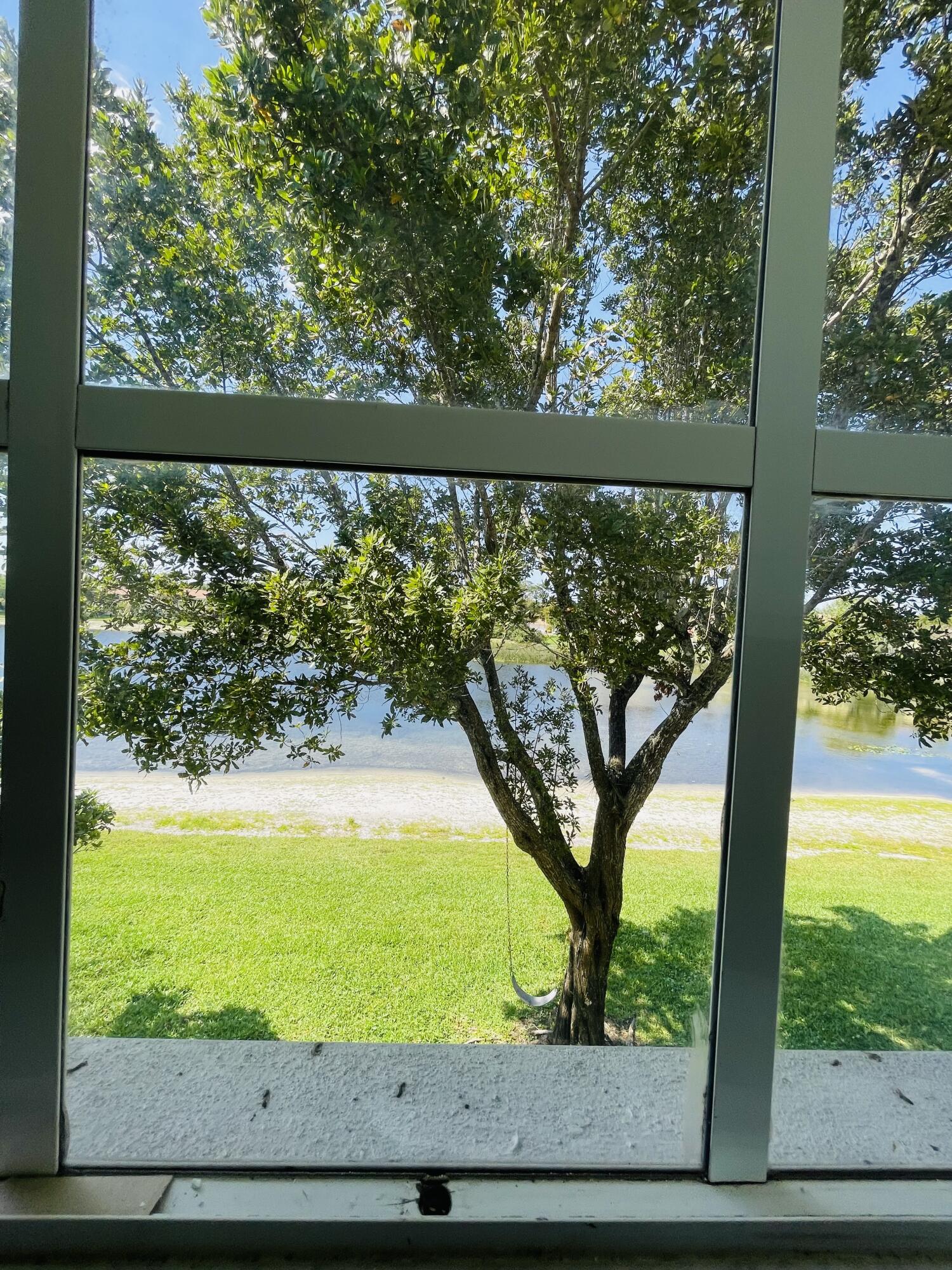 1146 Imperial Lake Road Lake Belvedere Estates, FL 33413 - Photo 18 of 20 a view of swimming pool from a window