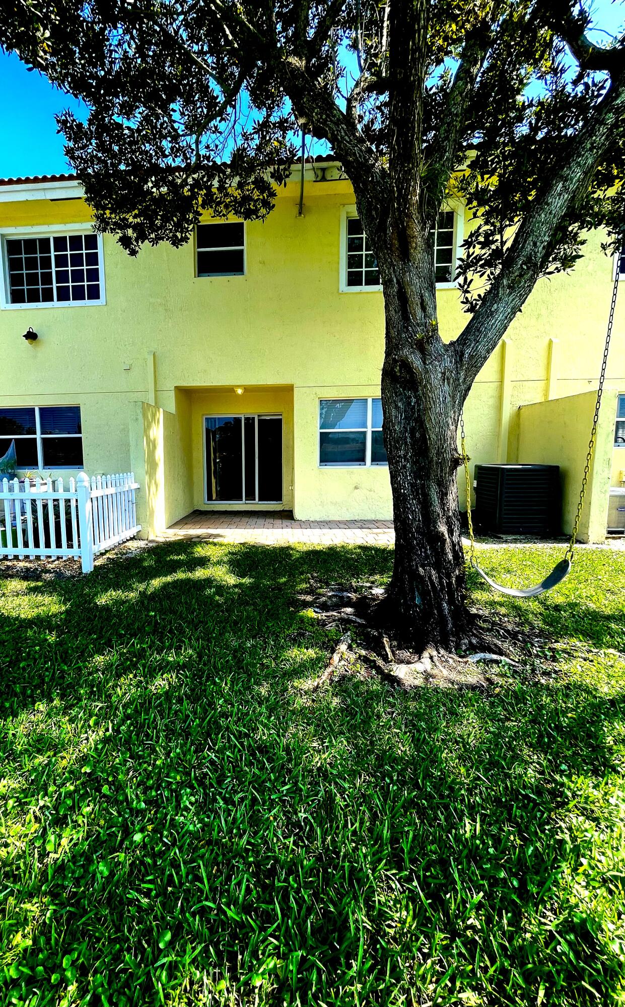 1146 Imperial Lake Road Lake Belvedere Estates, FL 33413 - Photo 20 of 20 a front view of a house with a yard