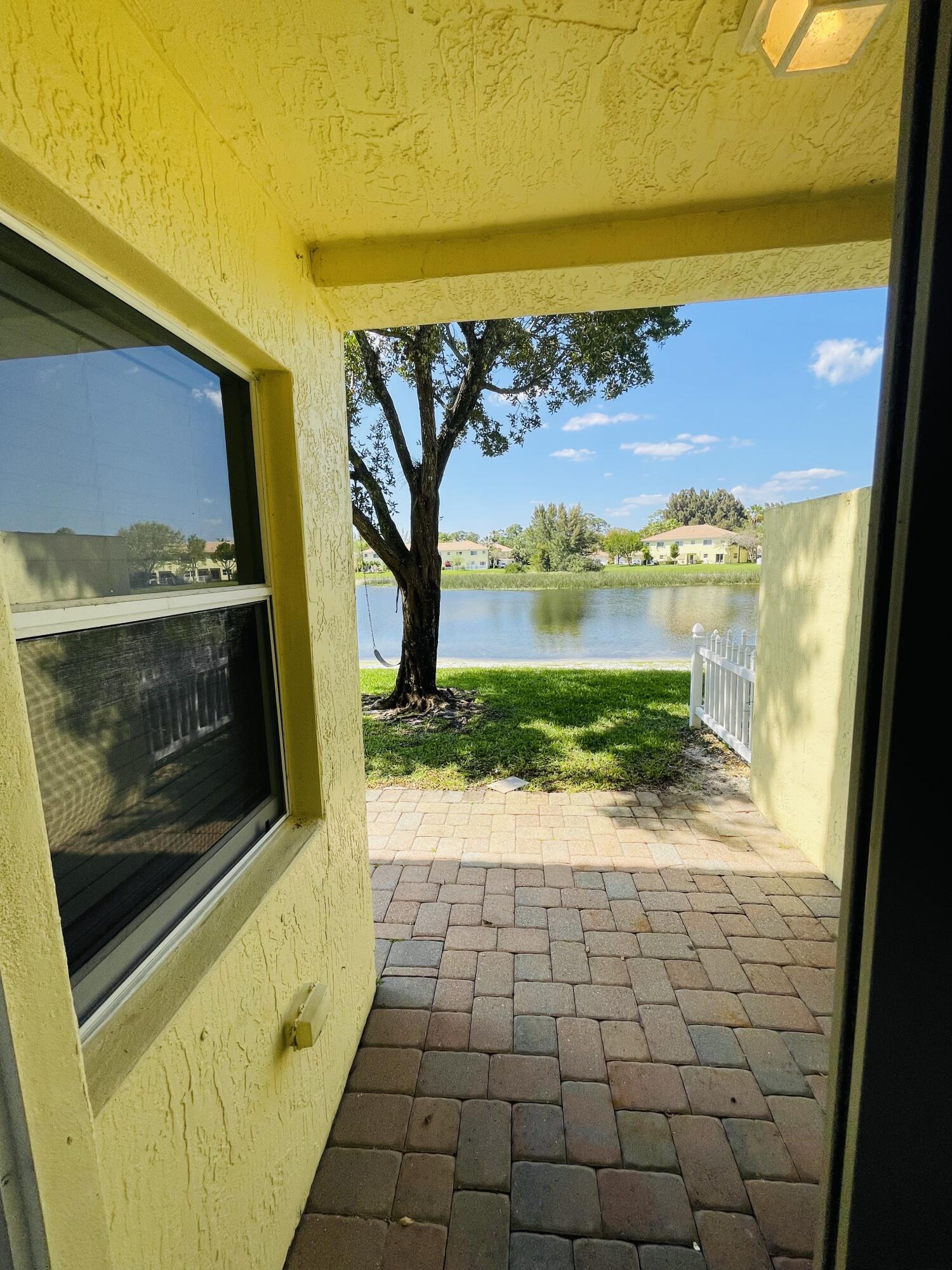 1146 Imperial Lake Road Lake Belvedere Estates, FL 33413 - Photo 10 of 20 a view of an empty room and window