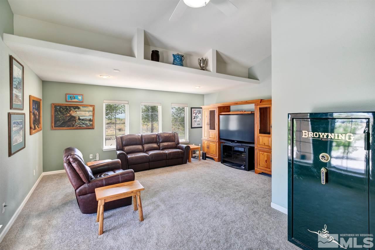 4111 Rancheria Road Fallon, NV 89406 - Photo 13 of 40 a living room with furniture and a flat screen tv