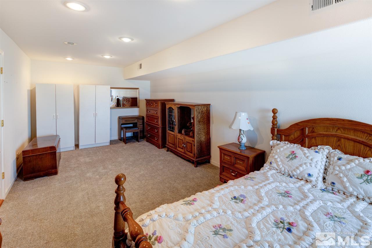 4111 Rancheria Road Fallon, NV 89406 - Photo 32 of 40 a bedroom with a bed and furniture