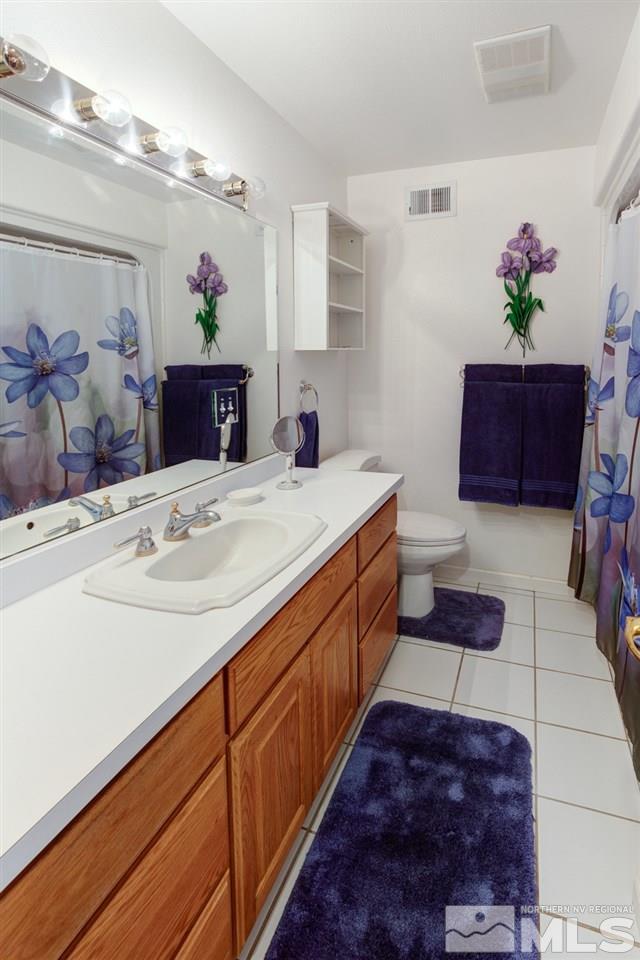 4111 Rancheria Road Fallon, NV 89406 - Photo 33 of 40 a spacious bathroom with a tub sink and mirror