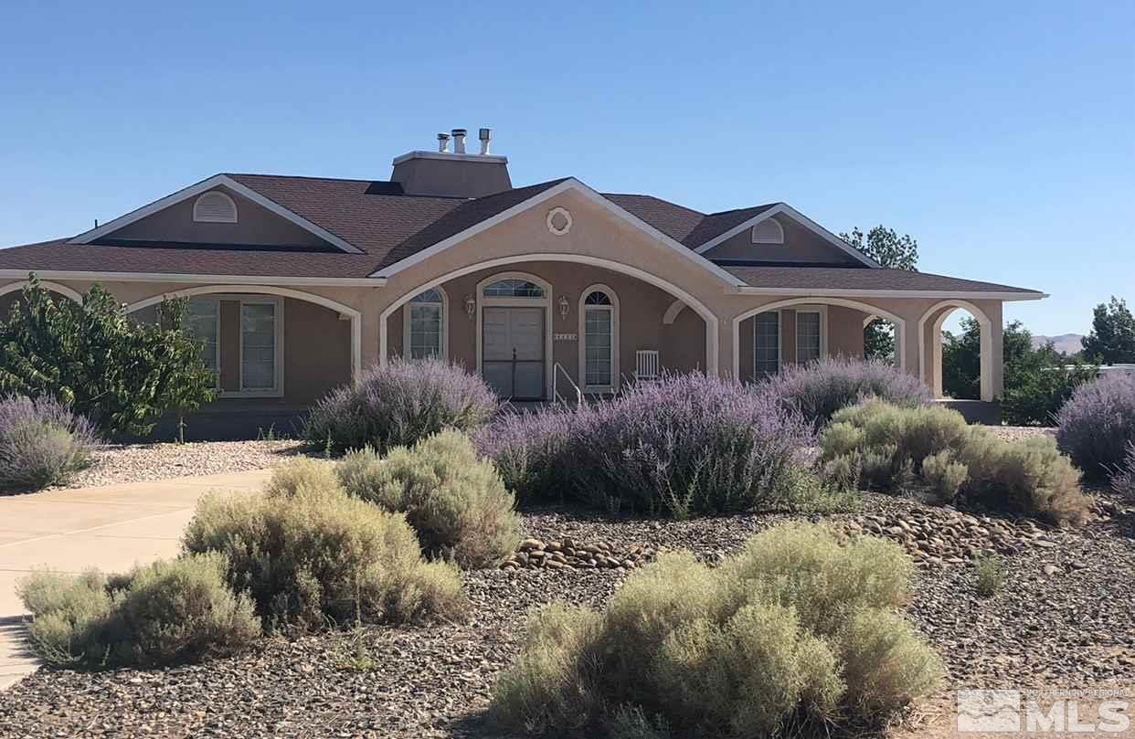 4111 Rancheria Road Fallon, NV 89406 - Photo 6 of 40 a front view of a house with a yard