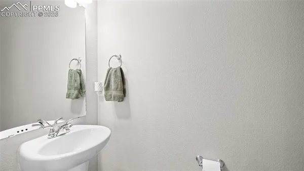 a bathroom with a sink and mirror