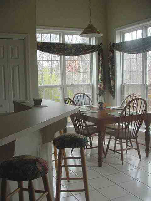300 Starcrest Road Charlottesville, VA 22902 - Photo 2 of 4 a view of a dining room with furniture window and outside view