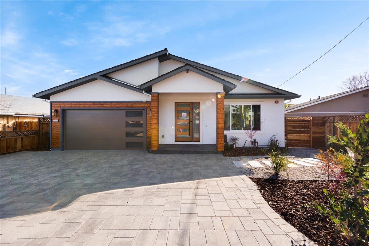 1472 South Wolfe Road Sunnyvale, CA 94087 - Photo 1 of 47 a front view of a house with a yard and garage