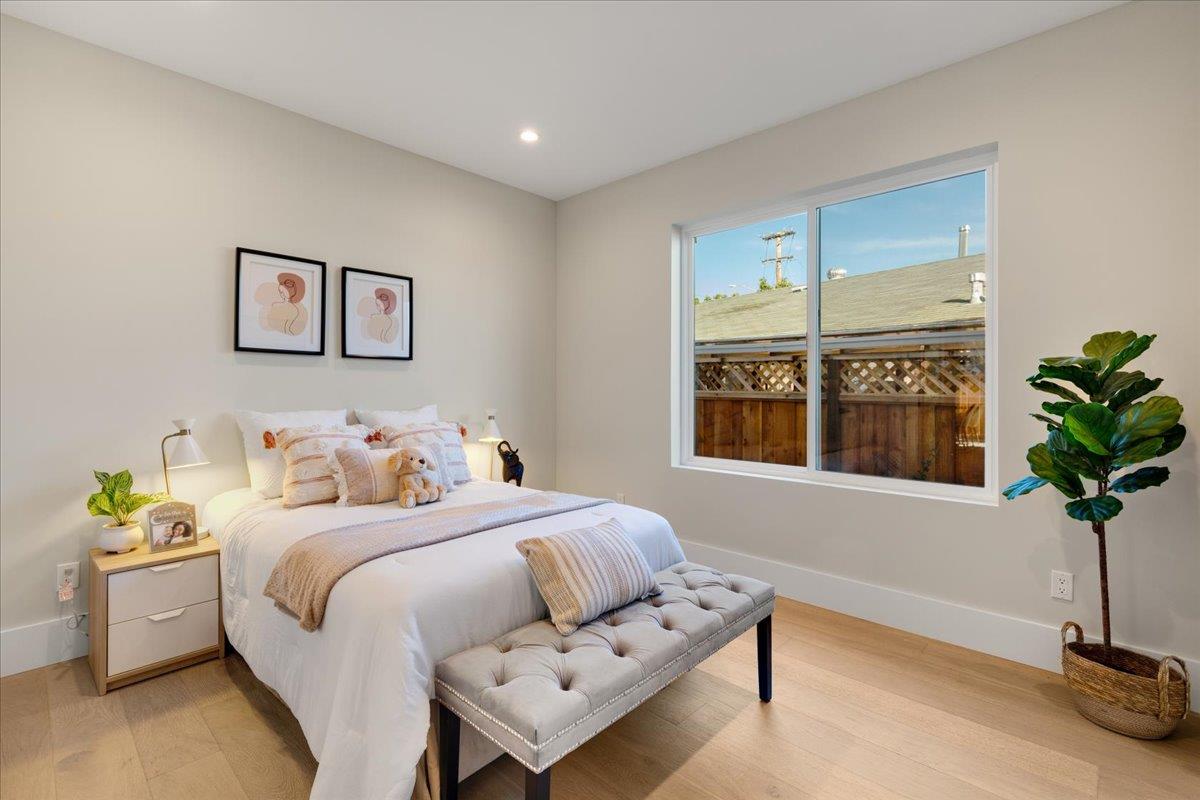 1472 South Wolfe Road Sunnyvale, CA 94087 - Photo 18 of 47 a bedroom with a bed and a potted plant