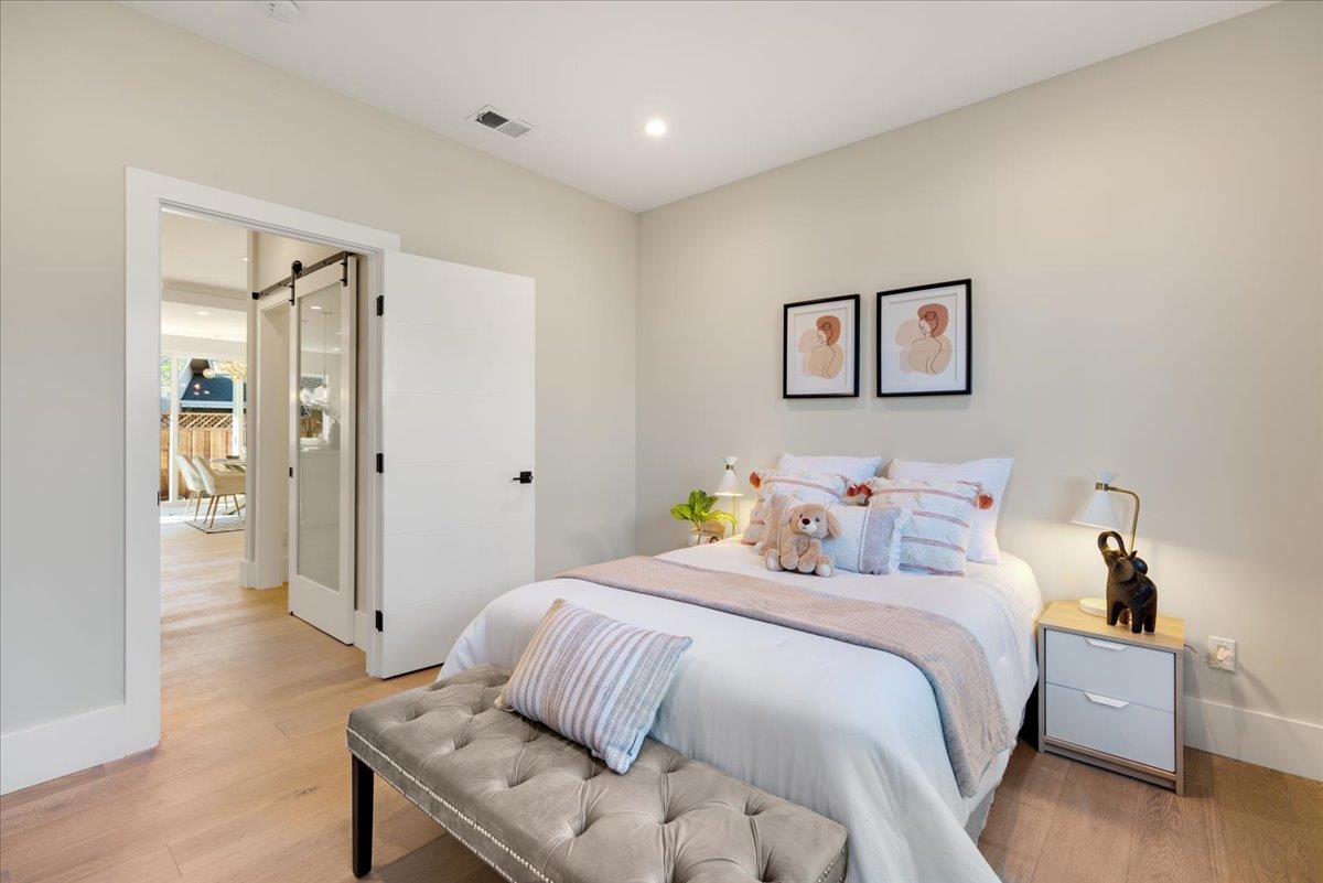 1472 South Wolfe Road Sunnyvale, CA 94087 - Photo 19 of 47 a bedroom with a bed and a painting on the wall