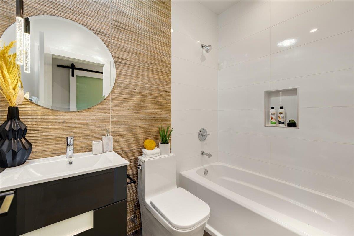 1472 South Wolfe Road Sunnyvale, CA 94087 - Photo 21 of 47 a bathroom with a toilet sink vanity tub and mirror