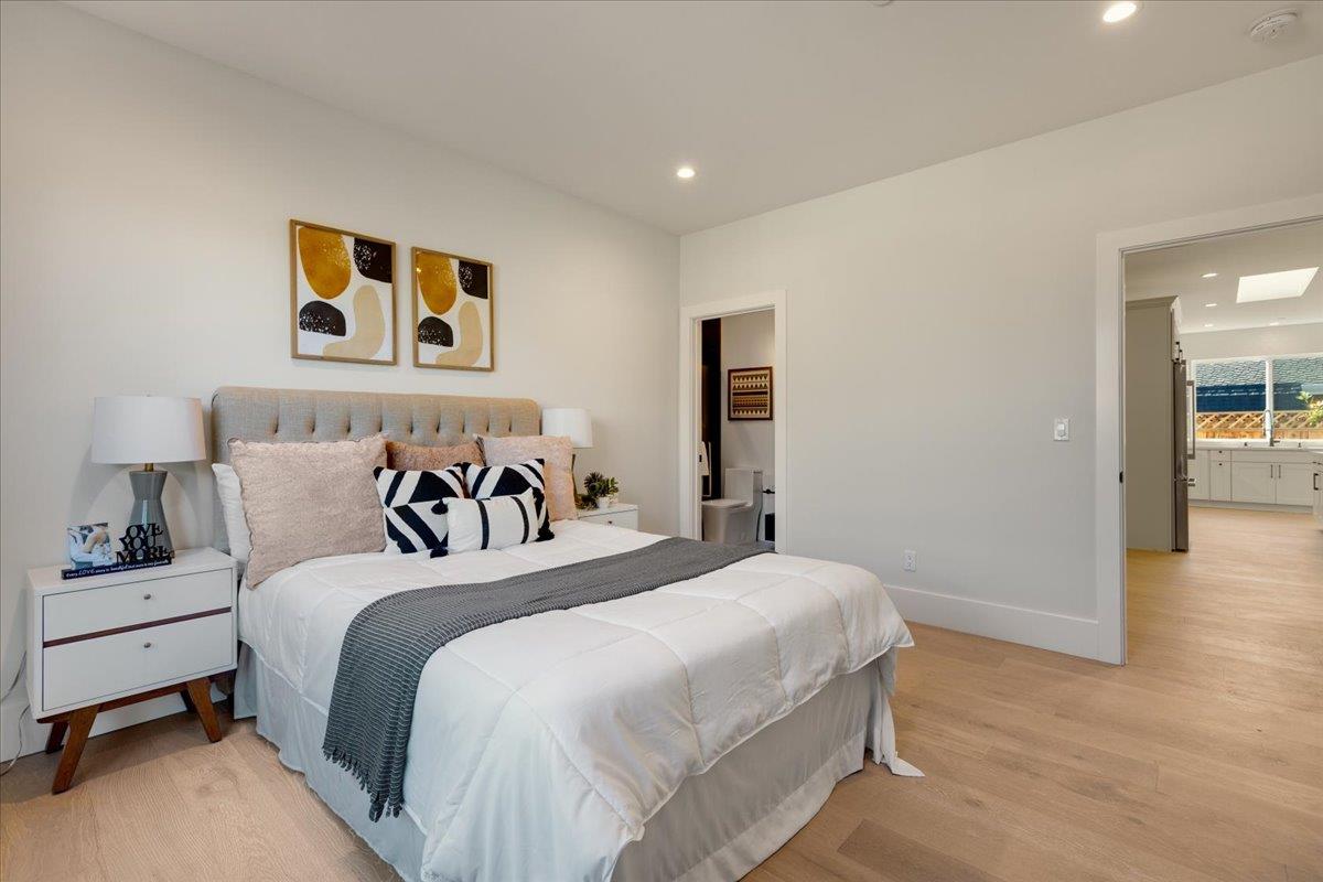 1472 South Wolfe Road Sunnyvale, CA 94087 - Photo 24 of 47 a bedroom with a bed and wooden floor