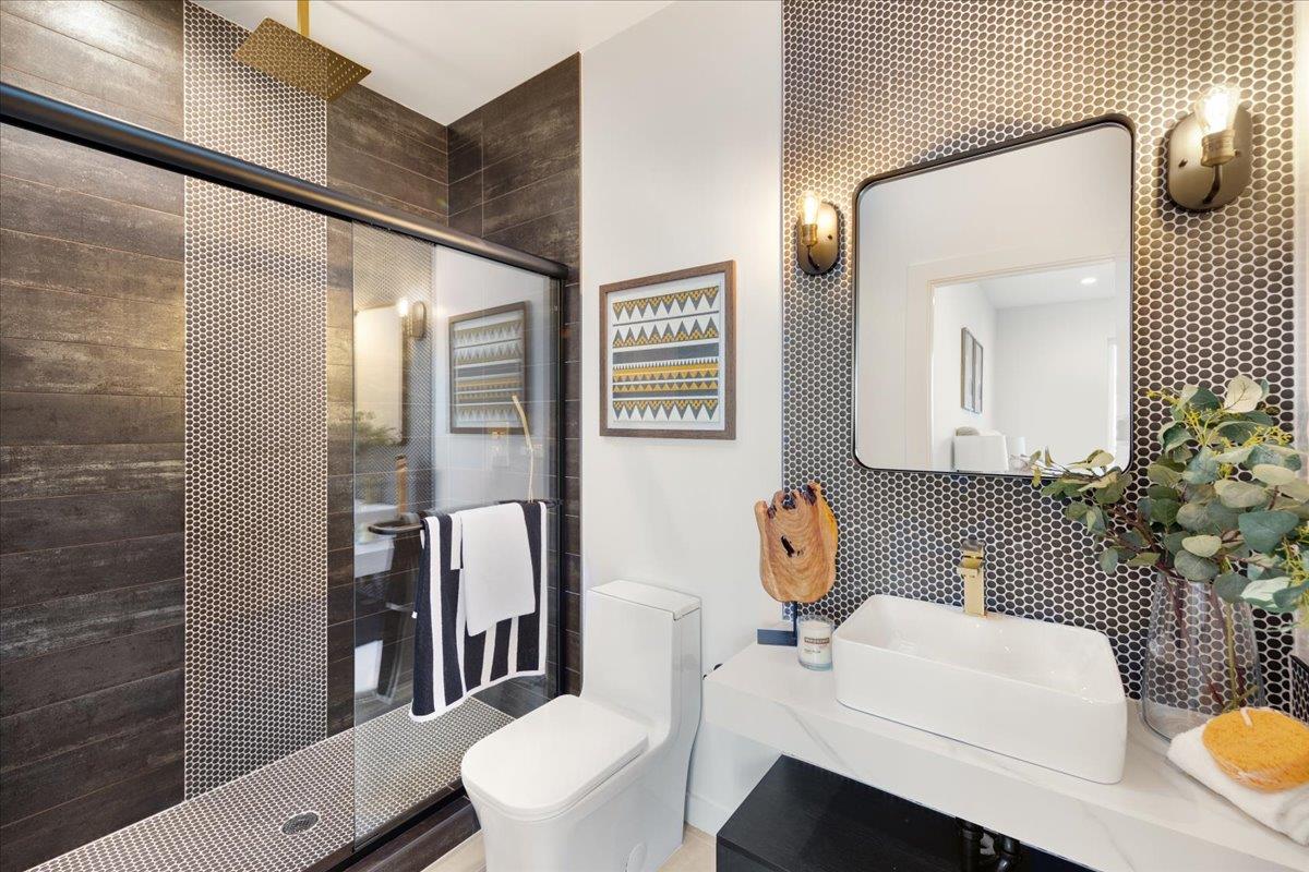 1472 South Wolfe Road Sunnyvale, CA 94087 - Photo 25 of 47 a bathroom with a toilet a sink and mirror