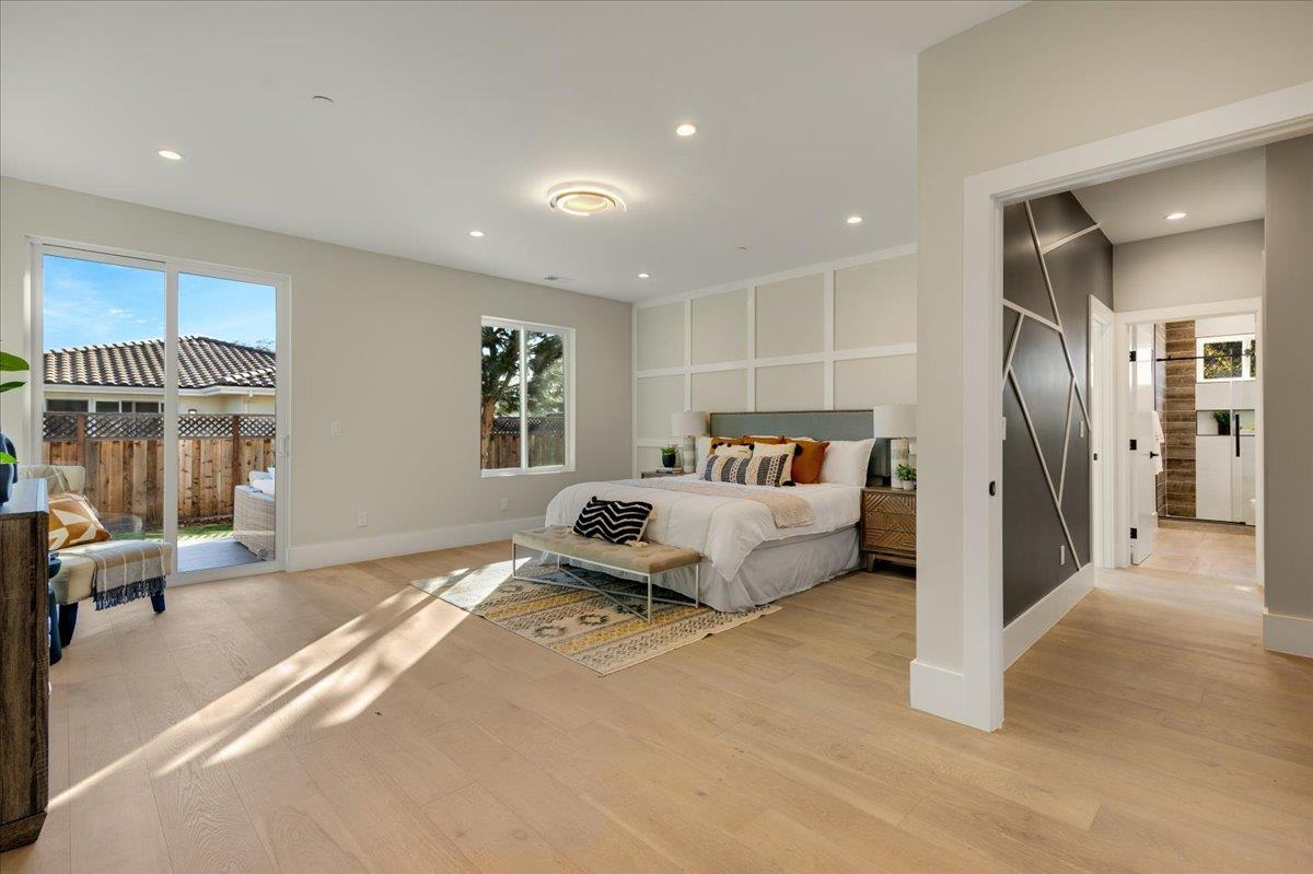 1472 South Wolfe Road Sunnyvale, CA 94087 - Photo 29 of 47 a spacious bedroom with a bed a couch and a large window