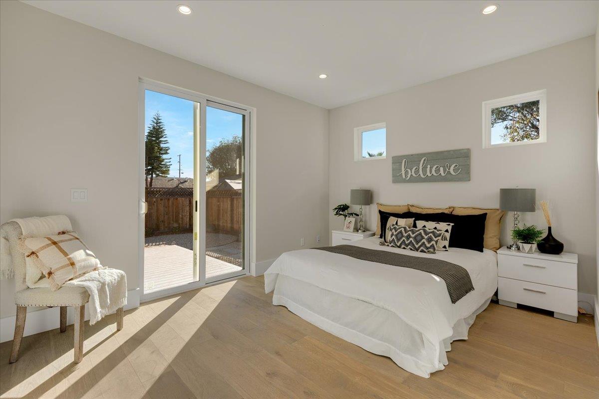 1472 South Wolfe Road Sunnyvale, CA 94087 - Photo 37 of 47 a bedroom with a bed and a large window
