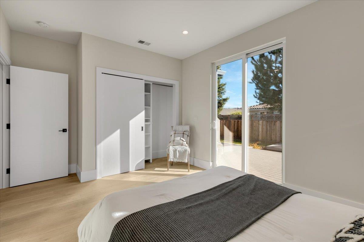 1472 South Wolfe Road Sunnyvale, CA 94087 - Photo 38 of 47 a bedroom with a bed and a large window