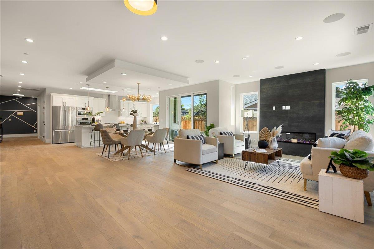 1472 South Wolfe Road Sunnyvale, CA 94087 - Photo 5 of 47 a living room with furniture and a flat screen tv