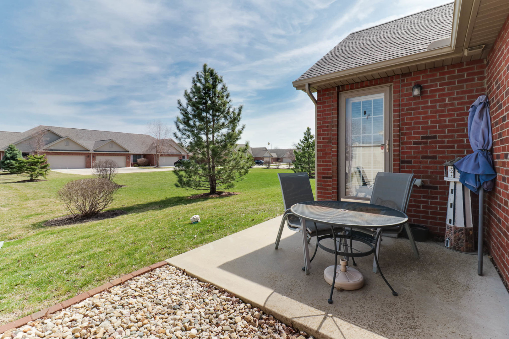 1770 Lockspur Way, Unit 1770 Normal, IL 61761 - Photo 36 of 39 a view of a house with backyard sitting area and garden