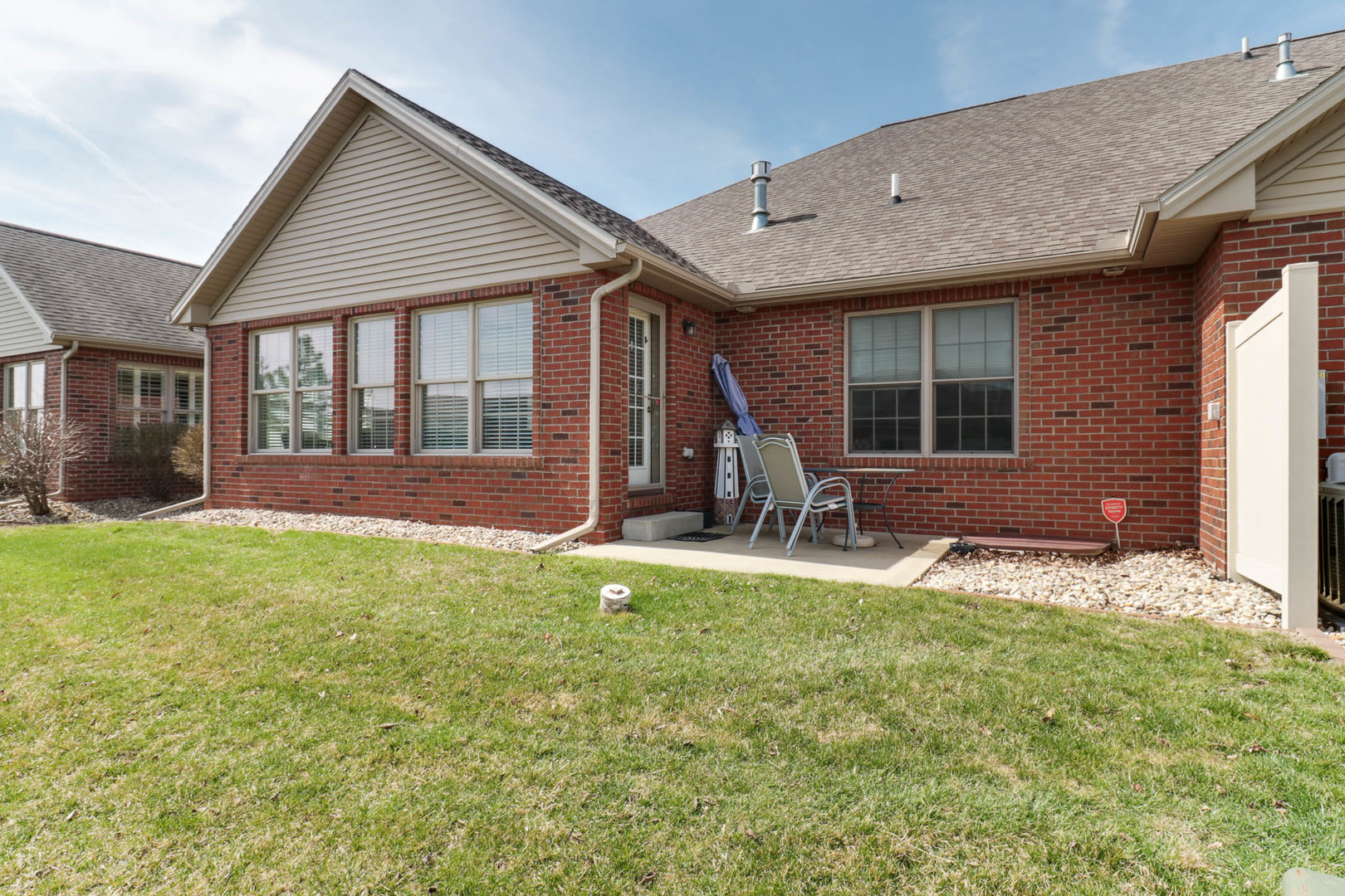 1770 Lockspur Way, Unit 1770 Normal, IL 61761 - Photo 37 of 39 a backyard of a house with yard and outdoor seating