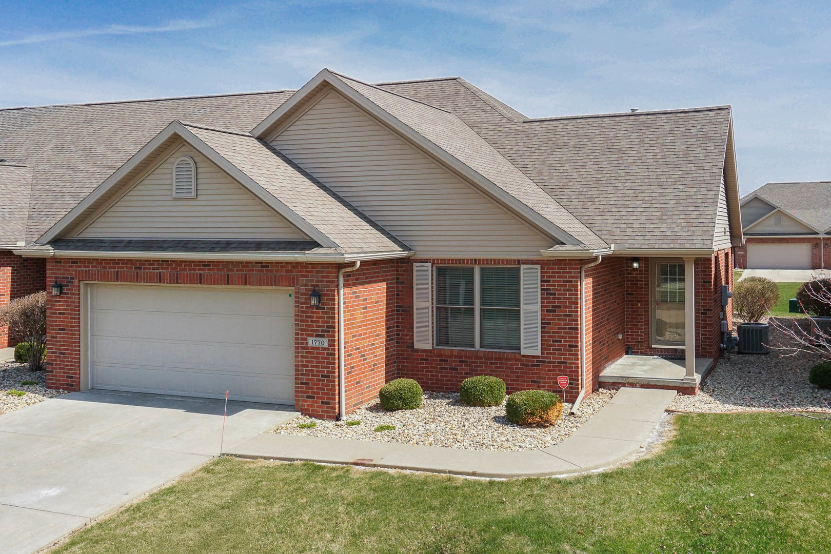 1770 Lockspur Way, Unit 1770 Normal, IL 61761 - Photo 39 of 39 a front view of a house with a yard and porch
