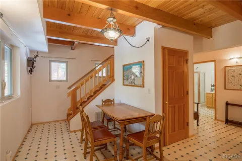 a view of entryway and hall with a dining table