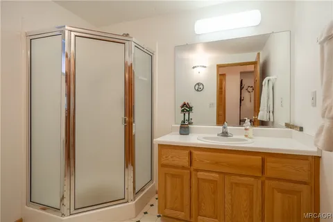 a bathroom with a mirror a sink and a mirror