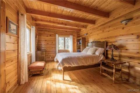 a balcony with furniture and wooden floor