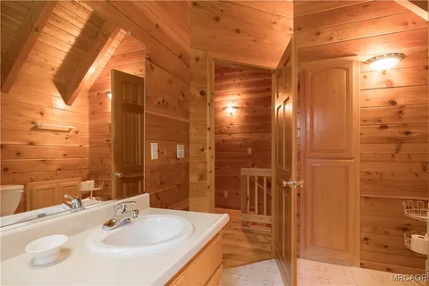 a bathroom with a shower and a sink