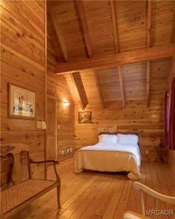 a view of a balcony with chair and wooden floor