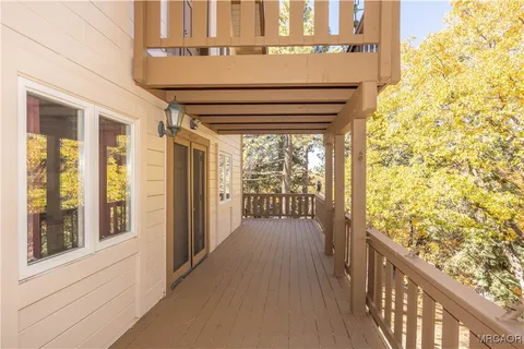 a view of balcony with wooden floor