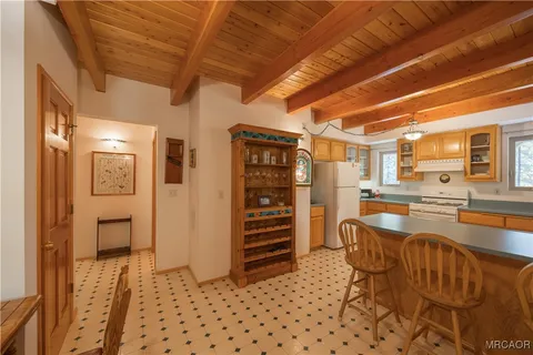 a hallway with a table and chairs