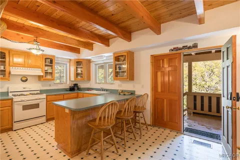 a kitchen with stainless steel appliances granite countertop a sink and cabinets