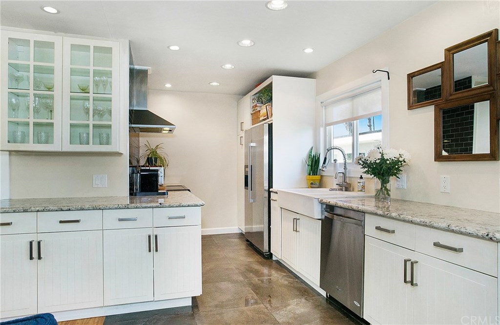 Enter into your beautiful, modern kitchen with light granite, stainless appliances, and abundant storage.
