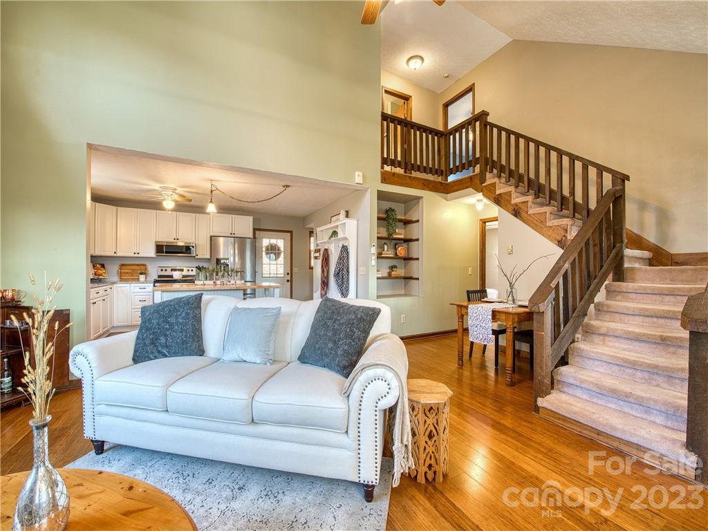 353 Rustic Heights Road Waynesville, NC 28785 - Photo 5 of 46 a living room with furniture and a dining table