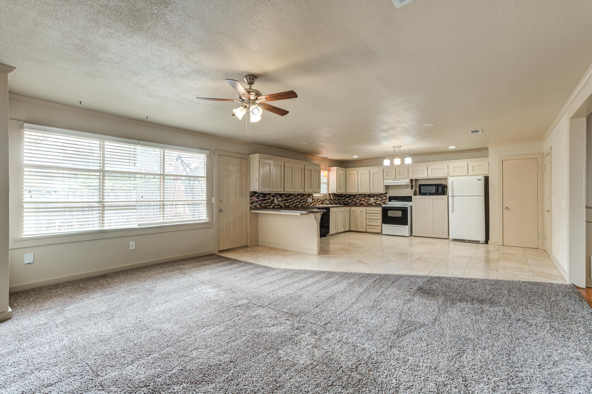 3517 47th Street Lubbock, TX 79413 - Photo 13 of 36 a view of an empty room with a window