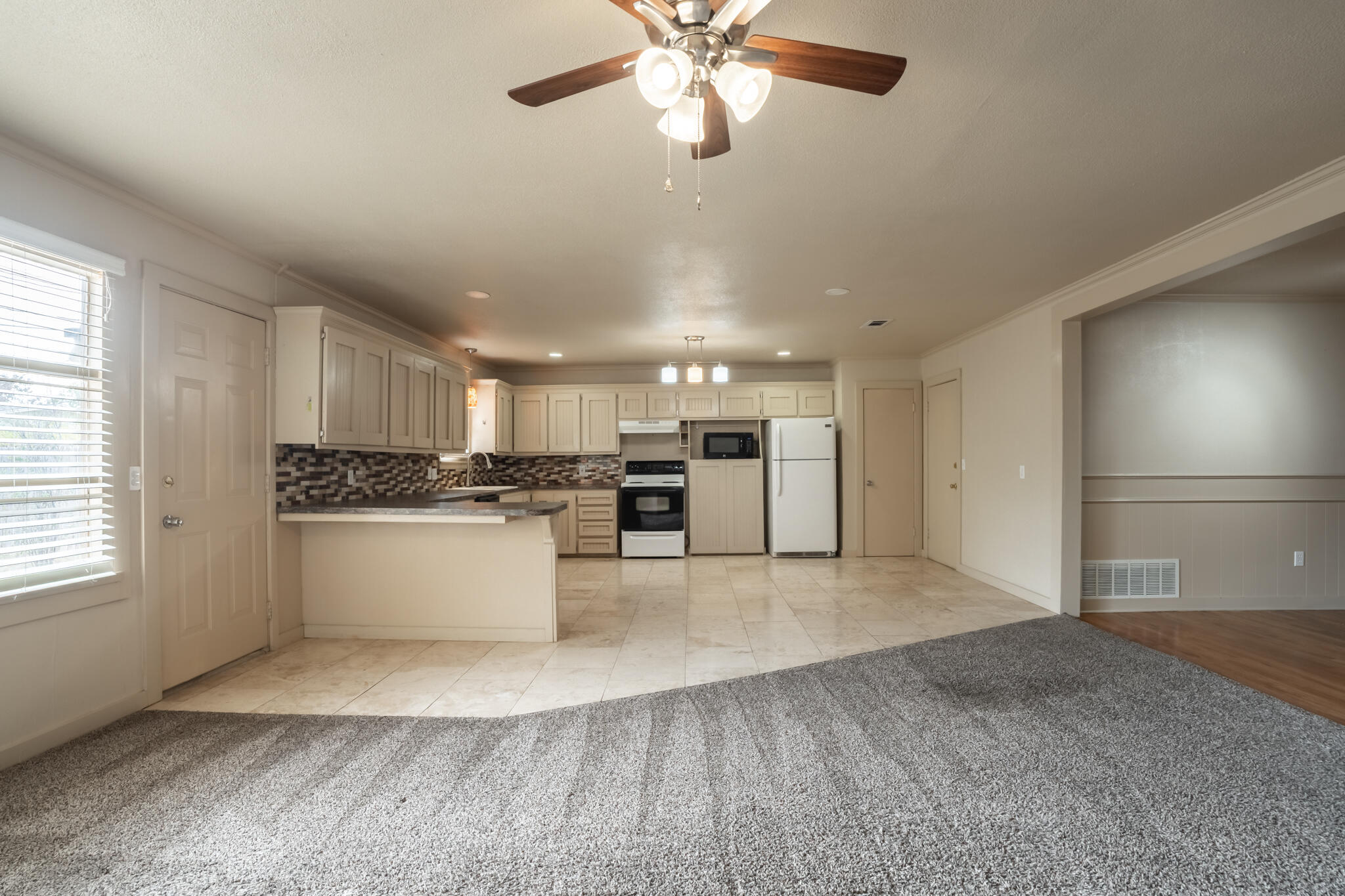 3517 47th Street Lubbock, TX 79413 - Photo 14 of 36 a view of kitchen with refrigerator oven and cabinets